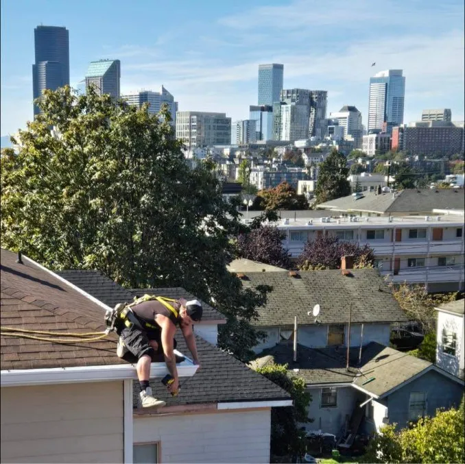 Contractor working on a roof in the Puget Sound region